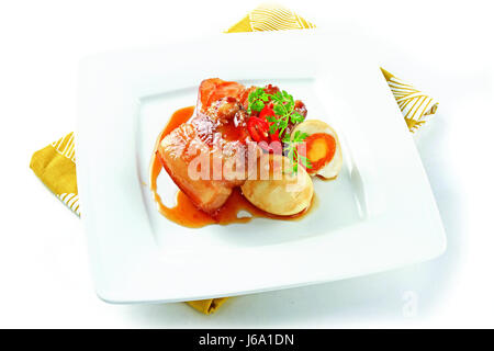 Vietnamese simmered meat with egg on white platter Stock Photo