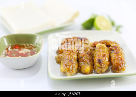 Baked rolls in vietnamese style with fish sauce and lime Stock Photo