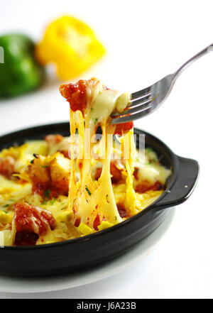 Baked boneless chicken with cheese and chili in black stew Stock Photo