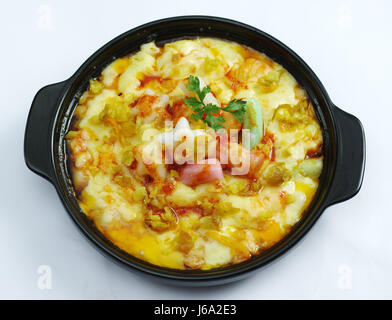 Rice Cake baked with Cheese Sauce on white background Stock Photo