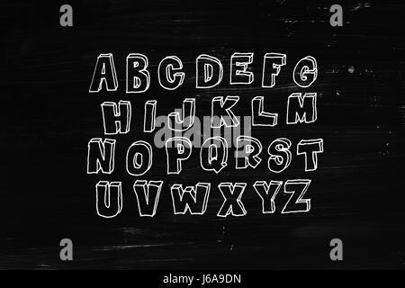 Hand drawn volumetric abc, doodle style. White letters over black chalkboard background, sketch illustration Stock Photo