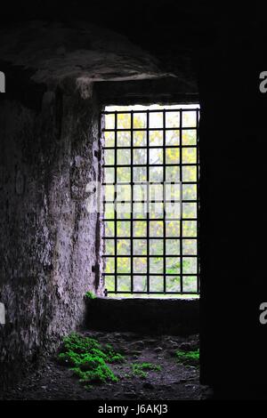 A tower window shown from inside Blarney Castle in Blarney, County Cork, Ireland. The castle was built in 1446 by Dermot McCarthy.