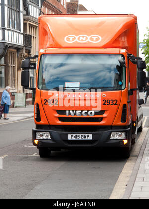 TNT Express lorry parked in street making delivery or collection, company part of FedEx Stock Photo