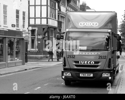 TNT Express lorry parked in street making delivery or collection, company part of FedEx Stock Photo