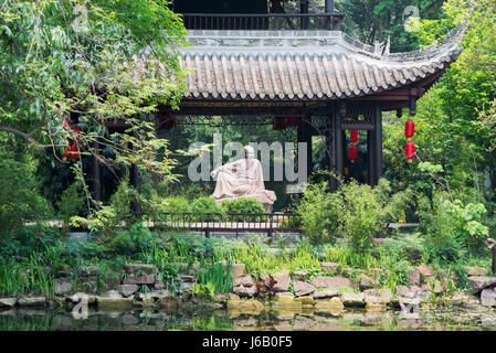 Meishan, Sichuan Province, China - Apr 30, 2017: Su Shi poet sculpture behind a pavilion in Meishan Stock Photo