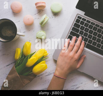 Woman hands typing on laptop Stock Photo