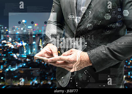 Chatbot and internet of things concept. Double exposure of Electric circuit graphic , technology chat bot icons.Business man suit hand using smart pho Stock Photo