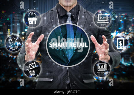 Smart retail and omni channel concept. Man business suit hand , Electric circuit graphic and info graphic of smart retail technology icons. Stock Photo
