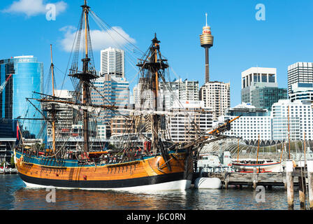 A replica of James Cook's HMS Endeavour, moored alongside the Australian National Maritime Museum in Darling Harbour, Sydney. Stock Photo