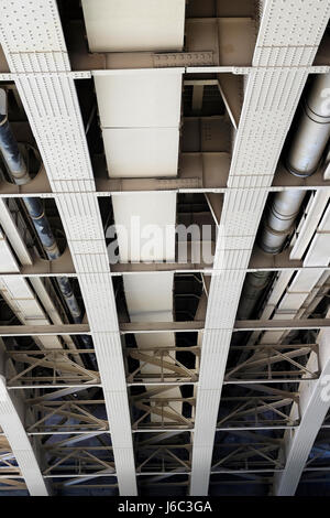 Metal structures of bridge, view from underneath, shapes, lines Stock Photo