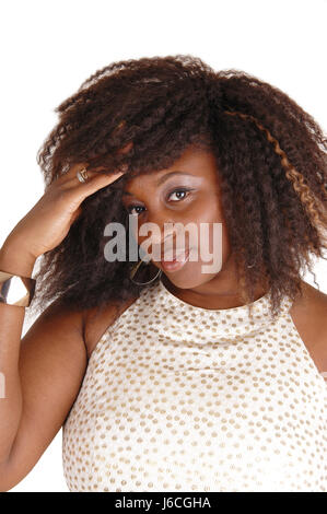 A lovely closeup portrait picture of a African American woman, smiling in a  beige dress, isolated for white background. Stock Photo