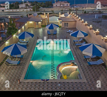 Aerial view of luxury tropical summer holiday villa show home swimming pool in resort at night Stock Photo