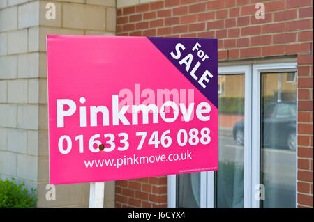 Estate agents for sale sign outside properties in Newport, South Wales, UK Stock Photo