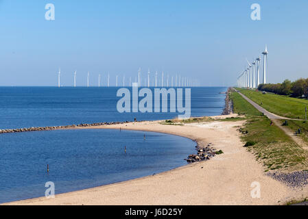 Electricity generating mills off the coast of Urk in the Netherlands Stock Photo