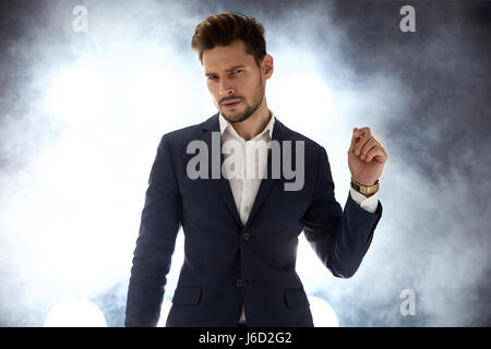 Handsome young guy in the night club Stock Photo
