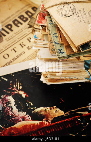 A stack of old postal letters of the 20th century and  the funeral photo of Stalin on the newspaper Pravda 1963 Stock Photo