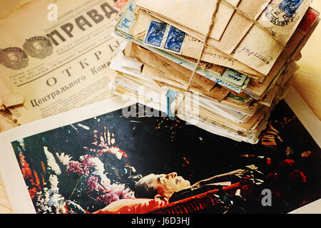 A stack of old postal letters of the 20th century and  the funeral photo of Stalin on the newspaper Pravda 1963 Stock Photo