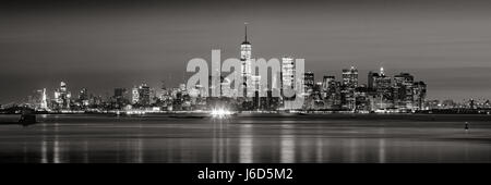 Panoramic view of Lower Manhattan Financial District skyscrapers in Black & White at dawn from New York City Harbor Stock Photo