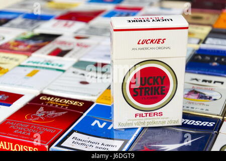 PRAGUE, CZECH REPUBLIC - MARCH 25: Lucky Strike pack on many different cigarettes photographed on March 25, 2017 in Prague, Czech republic. Stock Photo