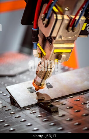 Fibre laser robotic remote cutting system. CNC Laser plasma cutting of metal, modern industrial technology. Stock Photo