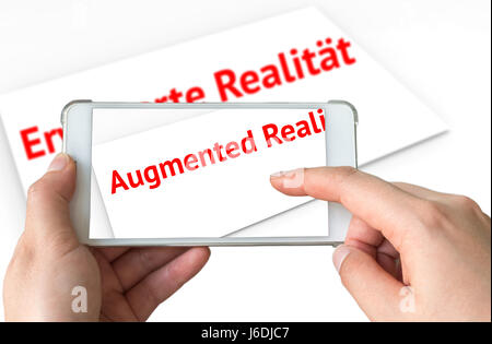 Augmented reality marketing translation concept. Hand holding smart phone using AR application to translate red text of Germany language to English on Stock Photo