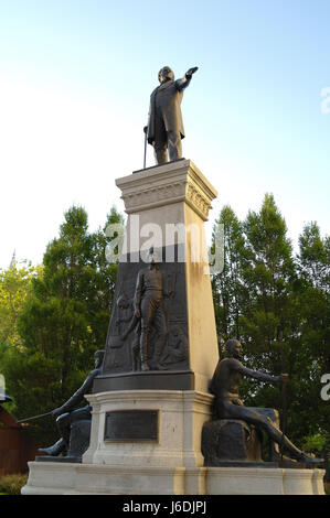 Blue sky portrait, towards green trees, Brigham Young and Pioneers Monument, Main and South Temple Streets, Salt Lake City, Utah, USA Stock Photo