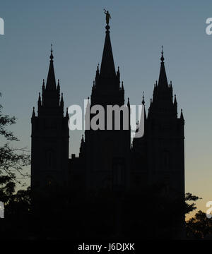 Blue sky sunset portrait eastern facade Salt Lake Temple, with the Angel Moroni on top of the tall Central Spire, Temple Square, Salt Lake City, Utah Stock Photo