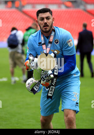 Millwall's Jordan Archer celebrates with the trophy after the Sky Bet League One play off final at Wembley Stadium, London. Stock Photo