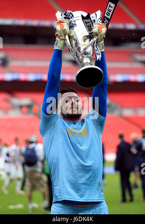 Millwall's Jordan Archer celebrates with the trophy after the Sky Bet League One play off final at Wembley Stadium, London. Stock Photo