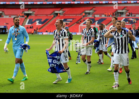 Millwall's Jordan Archer (left), Jed Wallace (centre) and Lee Gregory (right) celebrate after the Sky Bet League One play off final at Wembley Stadium, London. Stock Photo