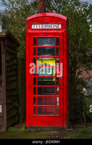 A defibrillator in an old telephone box. Mendham, Suffolk. Stock Photo