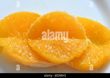 Slices of Oranges on a Plate Stock Photo