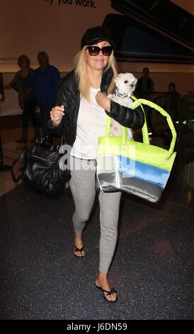 Heather Locklear at Los Angeles International Airport (LAX) with her little dog  Featuring: Heather Locklear Where: Los Angeles, California, United States When: 19 Apr 2017 Credit: WENN.com Stock Photo