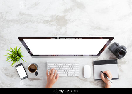 top view of creative photographer using graphic tablet on work table Stock Photo