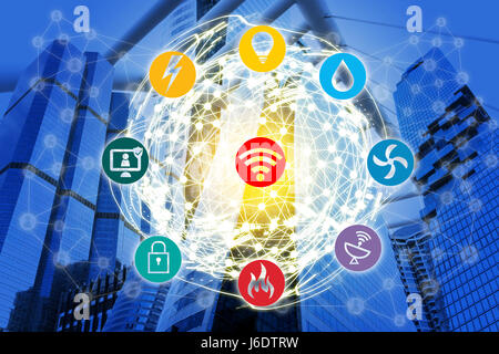 Smart Building and Internet of Things concept. Smart building management icons on office building and wireframe world connect with abstract digital co Stock Photo