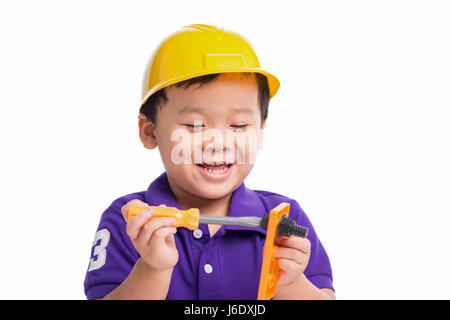 Little repairman in hardhat with repair tools Stock Photo