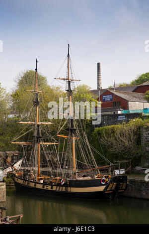 UK, Cornwall, St Austell, Charlestown, tall sailing ship Phoenix, 1929 built two masted brig moored in harbour moored below Shipwreck Museum Stock Photo