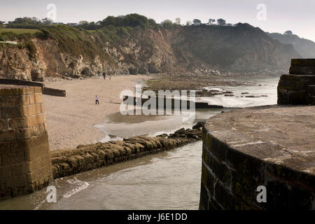 UK, Cornwall, St Austell, Charlestown, breakwater below cliffs at entrance to historic harbour Stock Photo