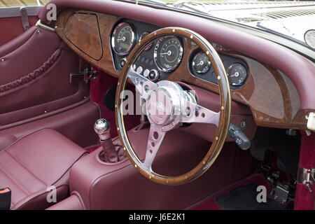Dashboard of a Classic Morgan Sports Car  photographed with a Wooden  Motolita spoked Steering Wheel Stock Photo