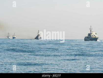 160815-N-GP524-128 ARABIAN GULF (Aug. 15, 2016) From left rear to right, the U.S. Navy guided-missile destroyer USS Stout (DDG 55), rear, the U.S. Coast Guard Island-class patrol cutters USCGC Wrangell (WPB 1332) and USCGC Monomoy (WPB 1326), the Iraqi navy Al Basra-class offshore support vessel Al Basra (OSV 401), the U.S. Navy Cyclone-class coastal patrol ship USS Monsoon (PC 4) and the Iraqi navy Swift Boat (P-311) transit in formation as part of a Commander, Task Force 55 bilateral exercise. The U.S. participates in bilateral exercises with partner nations routinely to build and strengthen Stock Photo