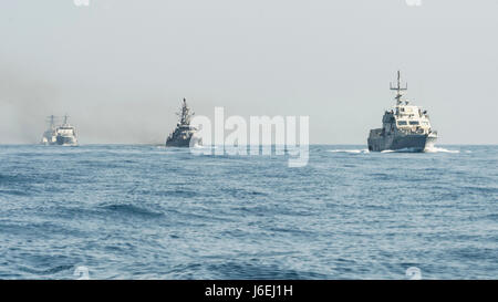 160815-N-GP524-138 ARABIAN GULF (Aug. 15, 2016) From left rear to right, the U.S. Navy guided-missile destroyer USS Stout (DDG 55), rear, the U.S. Coast Guard Island-class patrol cutters USCGC Wrangell (WPB 1332) and USCGC Monomoy (WPB 1326), the Iraqi navy Al Basra-class offshore support vessel Al Basra (OSV 401), the U.S. Navy Cyclone-class coastal patrol ship USS Monsoon (PC 4) and the Iraqi navy Swift Boat (P-311) transit in formation as part of a Commander, Task Force 55 bilateral exercise. The U.S. participates in bilateral exercises with partner nations routinely to build and strengthen Stock Photo
