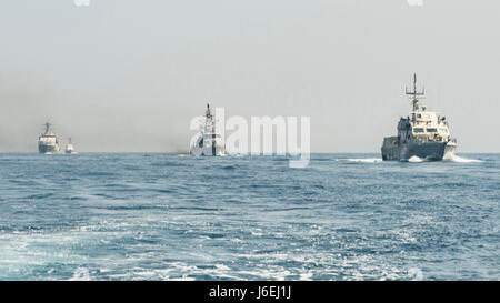 160815-N-GP524-146 ARABIAN GULF (Aug. 15, 2016) From left rear to right, the U.S. Navy guided-missile destroyer USS Stout (DDG 55), rear, the U.S. Coast Guard Island-class patrol cutters USCGC Wrangell (WPB 1332) and USCGC Monomoy (WPB 1326), the Iraqi navy Al Basra-class offshore support vessel Al Basra (OSV 401), the U.S. Navy Cyclone-class coastal patrol ship USS Monsoon (PC 4) and the Iraqi navy Swift Boat (P-311) transit in formation as part of a Commander, Task Force 55 bilateral exercise. The U.S. participates in bilateral exercises with partner nations routinely to build and strengthen Stock Photo