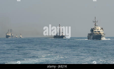 160815-N-GP524-166 ARABIAN GULF (Aug. 15, 2016) From left rear to right, the U.S. Navy guided-missile destroyer USS Stout (DDG 55), rear, the U.S. Coast Guard Island-class patrol cutters USCGC Wrangell (WPB 1332) and USCGC Monomoy (WPB 1326), the Iraqi navy Al Basra-class offshore support vessel Al Basra (OSV 401), the U.S. Navy Cyclone-class coastal patrol ship USS Monsoon (PC 4) and the Iraqi navy Swift Boat (P-311) transit in formation as part of a Commander, Task Force 55 bilateral exercise. The U.S. participates in bilateral exercises with partner nations routinely to build and strengthen Stock Photo