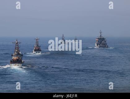 160815-N-GP524-355 ARABIAN GULF (Aug. 15, 2016) From left to right, the U.S. Coast Guard Island-class patrol cutters USCGC Monomoy (WPB 1326) and USCGC Wrangell (WPB 1332), the U.S. Navy Cyclone-class coastal patrol ship USS Monsoon (PC 4), the Iraqi navy Swift Boat (P-311) and the Iraqi navy Al Basra-class offshore support vessel Al Basra (OSV 401) transit the Arabian Gulf with the U.S. Navy guided-missile destroyer USS Stout (DDG 55), not shown, as part of a Commander, Task Force 55 bilateral exercise. The U.S. participates in bilateral exercises with partner nations routinely to build and s Stock Photo