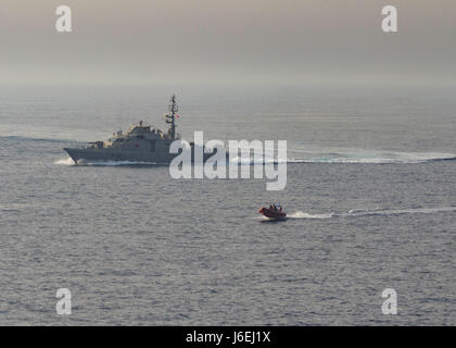 160815-N-GP524-479 ARABIAN GULF (Aug. 15, 2016) A rigid hull inflatable boat departs the Iraqi navy Swift Boat (P-311) during a Commander, Task Force 55 bilateral exercise with the guided-missile destroyer USS Stout (DDG 55), not shown. The U.S. participates in bilateral exercises with partner nations routinely to build and strengthen interoperability throughout the region. Commander, Task Force 55 controls surface forces including U.S. Navy patrol crafts and U.S. Coast Guard patrol boats throughout the U.S. 5th Fleet area of operations. (U.S. Navy photo by Mass Communication Specialist 3rd Cl Stock Photo