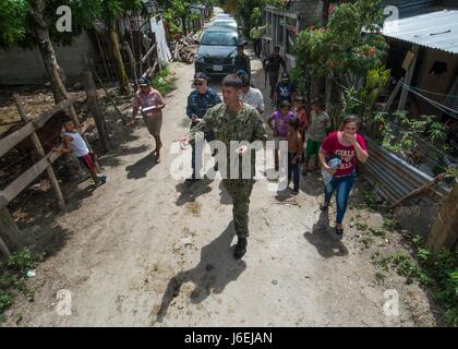 CHOLOMA, Honduras (Aug. 17, 2016) – U.S. Navy Lt. Cmdr. Patrick McKenna, a preventive medicine officer assigned to Navy Environmental Preventive Medicine Unit 2, marks the GPS coordinates for every house in the Monte Verde area during Southern Partnership Station 2016 (SPS-16). Logging 339 houses, McKenna is enabled Operation Blessing to have a sustainable system of tracking their pest control efforts against the zika virus. SPS-16 is an annual series of U.S. Navy deployments focused on subject matter expert exchanges with partner nation militaries and security forces in Central and South Amer Stock Photo