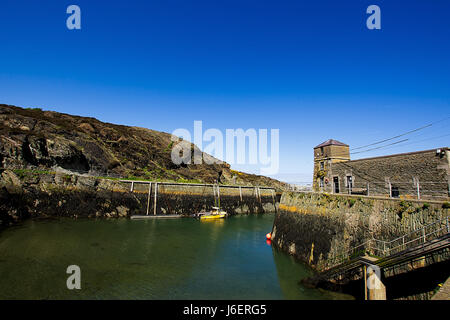 Historic fishing village Port Amlwch ,Anglesey ,North Wales,Uk.Entry to port,beautiful blue,clear sky and fantastic spring weather.Landscape Uk. Stock Photo