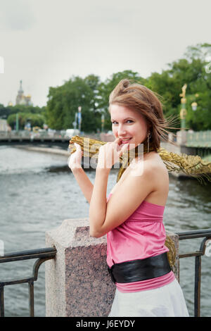 portrait of cheerful young woman near the river outdoor Stock Photo