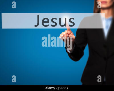 Jesus - Businesswoman hand pressing button on touch screen interface. Business, technology, internet concept. Stock Photo Stock Photo