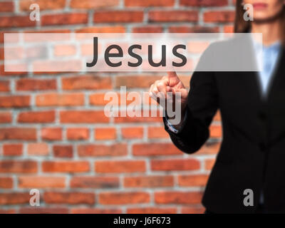 Jesus - Businesswoman hand pressing button on touch screen interface. Business, technology, internet concept. Stock Photo Stock Photo